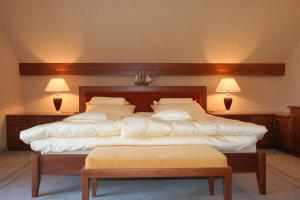 a bedroom with two beds with white pillows at PRIVILLAGE Stare - B&B in Bohinj