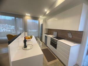 a kitchen with a counter with a bowl of fruit at Ventana del Nublo 2-D in Tejeda
