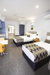 Postel nebo postele na pokoji v ubytování Altitude Motel Apartments
