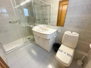 a bathroom with a toilet and a sink and a shower at Apartment Escor in Segur de Calafell