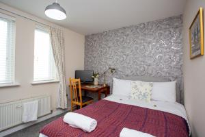 Katil atau katil-katil dalam bilik di Charming 2-bedroom Apartment Durham