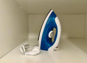 a blue and white telephone sitting on a counter at K22 Komputerowa 7 Chopin Airport in Warsaw