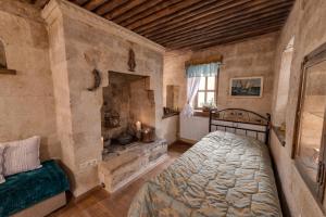 A bed or beds in a room at Hotel Temenni Evi