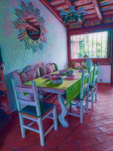 a dining room with a table and four chairs at Villa Sabry in Turriaco +42 photos