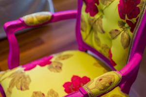a close up of a pink high chair with a seat at Luxury City One-bedroom Apartment in Heraklio