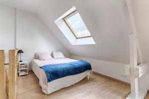 Résidor - Sublime Maison avec grand Terrasse tesisinde bir odada yatak veya yataklar