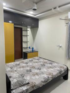 En eller flere senge i et værelse på Vinayaka Villas