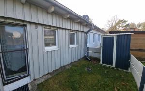 a side view of a house with a yard at Casa Mia 40 am See in Joachimsthal +5 photos