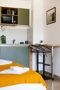 Posteľ alebo postele v izbe v ubytovaní Studio avec parking vue sur la Cité de Carcassonne