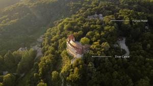 an aerial view of a mansion in the middle of a forest at Forest Hotel in Krakow
