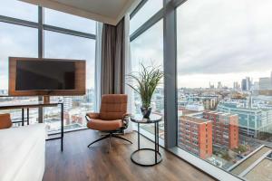 a hotel room with a view of a city at Radisson Blu Hotel Frankfurt in Frankfurt/Main