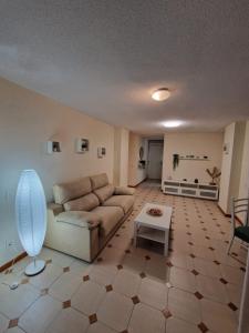 a living room with a couch and a table at Costa Blanca apartment in Alicante