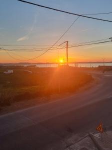 a sunset on the side of a road at Vivenda Sol E Mar in Baleal