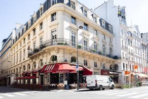 a white van parked in front of a building at Charming Suite 1bdr Saint Honoré Parisian Escape in the Heart of the City NO ELEVATOR in Paris
