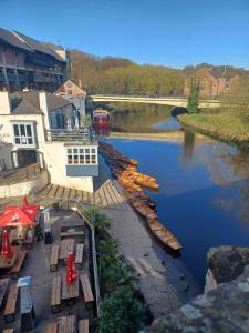 a group of boats are docked in a river at Eskdale Durham DH1 in Durham