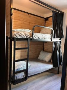 a couple of bunk beds in a room at Onefam Madrid in Madrid