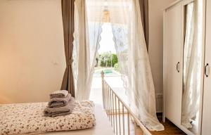 Ένα ή περισσότερα κρεβάτια σε δωμάτιο στο Beautiful Villa Torre IV with sauna in Tar +39 φωτογραφίες