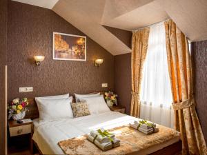Postel nebo postele na pokoji v ubytování Hotel&SPA Pysanka, Готель Писанка, 3 сауни та джакузі - індивідуальний відпочинок у СПА