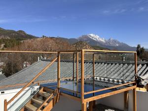 a view from the roof of a house at Lijiang Hengchang Baoyin Mohuakai Inn in Lijiang