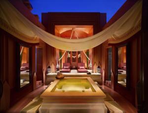 a bedroom with a tub in the middle of a room at The BARAI by Hyatt in Hua Hin