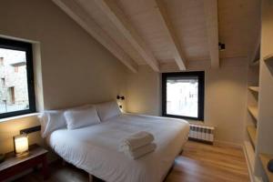 Postel nebo postele na pokoji v ubytování Cal Rus Apartament 3