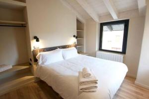 Postel nebo postele na pokoji v ubytování Cal Rus Apartament 3