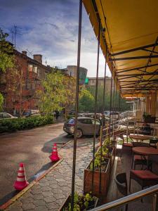 a patio with red cones on the side of a street at Aiva Hostel in Bishkek