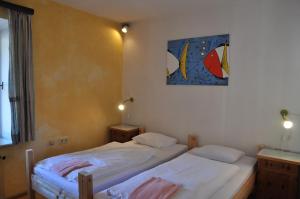 Voodi või voodid majutusasutuse Hotel Schwarzer Adler Sillian toas