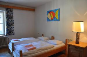 Voodi või voodid majutusasutuse Hotel Schwarzer Adler Sillian toas