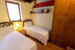 Posteľ alebo postele v izbe v ubytovaní Apartament la Perdiu