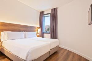 Posteľ alebo postele v izbe v ubytovaní Hotel Acta Azul Barcelona