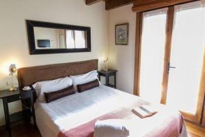 Posteľ alebo postele v izbe v ubytovaní Apartament l'Oreneta