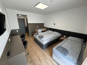 A bed or beds in a room at F Hotel 24h Check-In