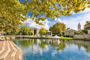 a view of a pond with a boat in it at New apartment near Split with garage in Solin