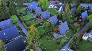 an aerial view of a house with blue roofs at Nurdachhaus Ferienpark Schellbron in Schellbronn