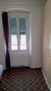 an empty room with a window and a floor at Casa Marina 50 mt dal mare in Imperia +34 photos