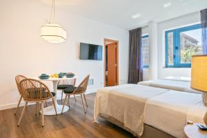 Posteľ alebo postele v izbe v ubytovaní Hotel Acta Azul Barcelona