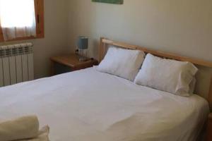 A bed or beds in a room at Apartamento Central