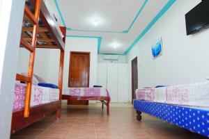 Letto o letti in una camera di Hotel Canoa´s Wonderland