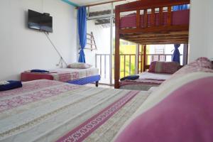 Letto o letti in una camera di Hotel Canoa´s Wonderland