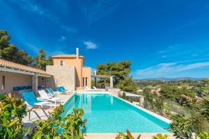 an image of a villa with a swimming pool at Villa Emmelia & Guesthouse Amazing View with Pool in Porto Heli