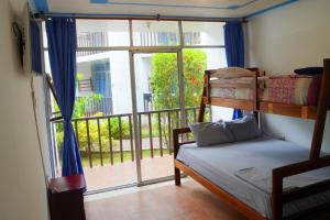 Postel nebo postele na pokoji v ubytování Hotel Canoa´s Wonderland