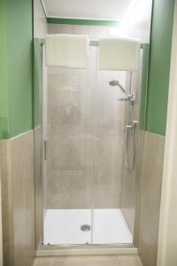 a shower with a glass door in a bathroom at Casa Consani in Ventimiglia