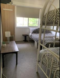 Ένα ή περισσότερα κρεβάτια σε δωμάτιο στο Mountain Lodge - sleeps 10