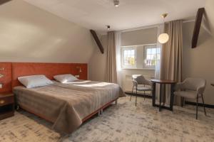 Posteľ alebo postele v izbe v ubytovaní Ołowianka B&B