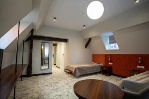 Posteľ alebo postele v izbe v ubytovaní Ołowianka B&B