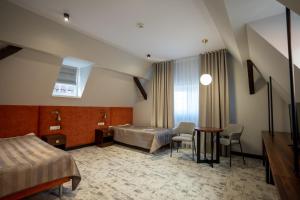 Posteľ alebo postele v izbe v ubytovaní Ołowianka B&B
