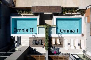 a view of two swimming pools on a building at Omnia Luxury Villas in Chania Town