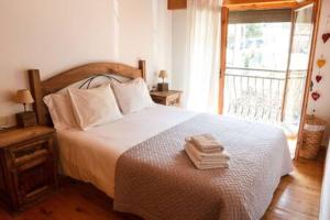 Postel nebo postele na pokoji v ubytování La Cabana dels Isards