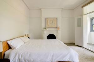 Ένα ή περισσότερα κρεβάτια σε δωμάτιο στο Beautiful & Ultra Convenient 4-bdrm Terrace